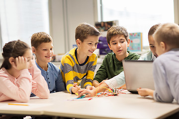 Image showing happy children with laptop at robotics school