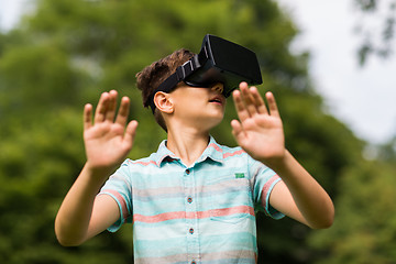 Image showing boy with virtual reality headset outdoors