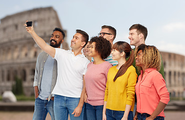 Image showing group of people taking selfie by smartphone