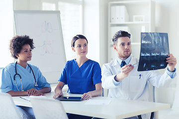 Image showing group of doctors discussing x-ray image