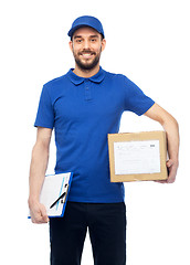 Image showing happy delivery man with parcel box and clipboard