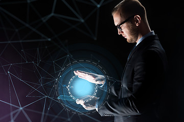 Image showing businessman with light above transparent tablet pc