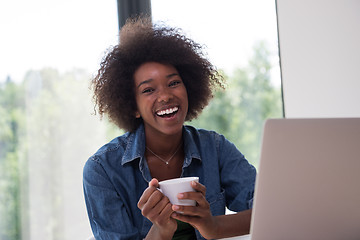 Image showing African American woman in the living room