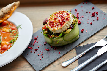 Image showing goat cheese salad with vegetables at restaurant