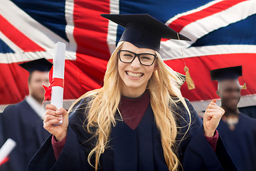 Image showing happy student with diploma celebrating graduation