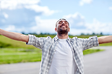 Image showing happy smiling man outdoors at summer