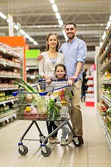 Image showing family with food in shopping cart at grocery store