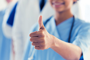 Image showing close up of doctor or nurse showing thumbs 