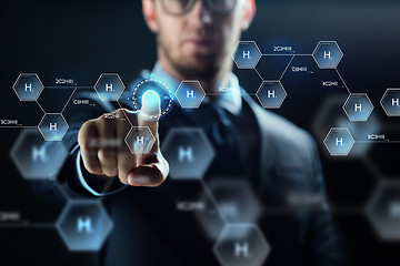 Image showing close up of scientist and virtual chemical formula