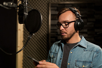 Image showing man with headphones at music recording studio