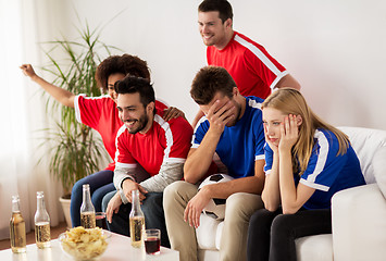 Image showing friends or football fans watching soccer at home