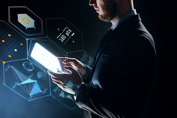 Image showing businessman with tablet pc and virtual projection