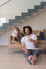 Image showing couple relaxing at  home with tablet computers