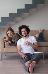 Image showing couple relaxing at  home with tablet computers