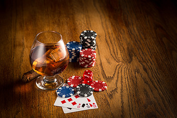 Image showing Cigar, chips for gamblings, drink and playing cards