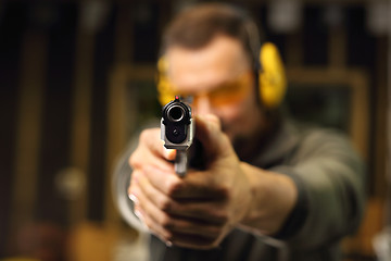 Image showing Gun. Sport shooting range. The man at the shooting range.