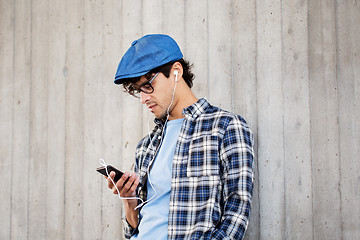 Image showing man with earphones and smartphone listening music