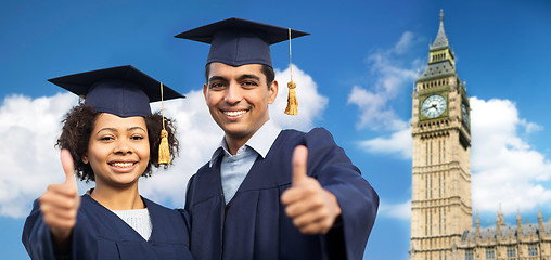 Image showing happy students or bachelors showing thumbs up