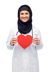 Image showing muslim female doctor in hijab holding red heart