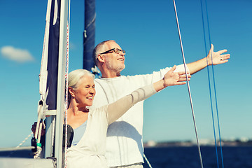 Image showing senior couple hugging on sail boat or yacht in sea