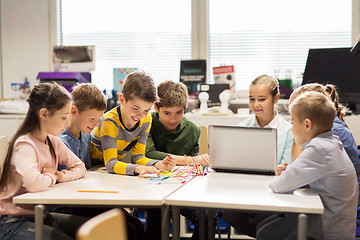 Image showing happy children with laptop at robotics school