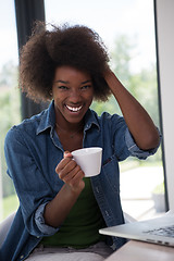 Image showing African American woman in the living room