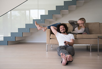 Image showing young couple relaxes in the living room