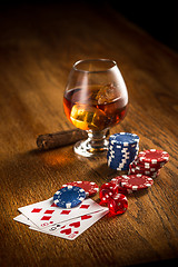 Image showing Cigar, chips for gamblings, drink and playing cards