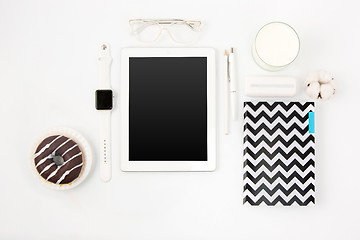 Image showing Top view of white office table with laptop