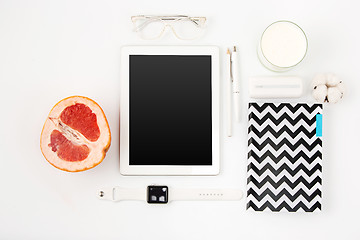 Image showing Top view of white office table with laptop