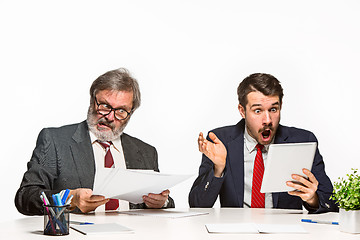 Image showing The two colleagues working together at office on white background.