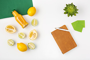 Image showing Top view of white office female workspace with notebook