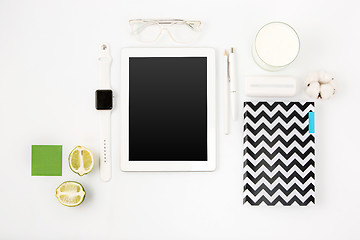 Image showing Top view of white office table with laptop