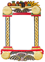 Image showing Old wooden hand made frame with fruits motif isolated on white b