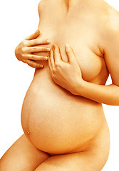 Image showing pregnant woman that covers her breast
