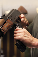 Image showing Shooting a gun at a shooting range.