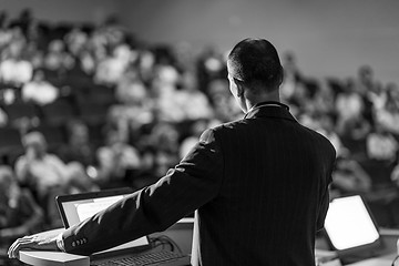 Image showing Public speaker giving talk at business event.