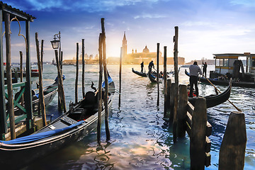 Image showing Venetian Gondolas in Italy, sunset behind San Giorgio Maggiore c