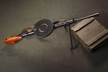 Image showing The weapon lies on the boxes of ammunition