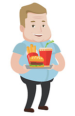Image showing Man holding tray full of fast food.