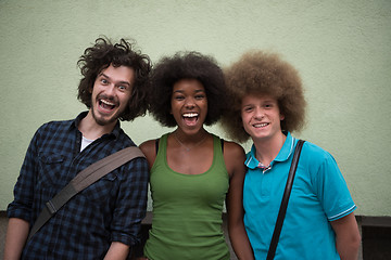 Image showing multiethnic group of happy three friends