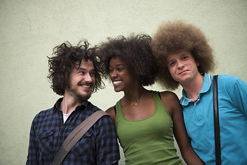 Image showing multiethnic group of happy three friends