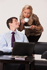 Image showing Young Woman And Man with a notebook