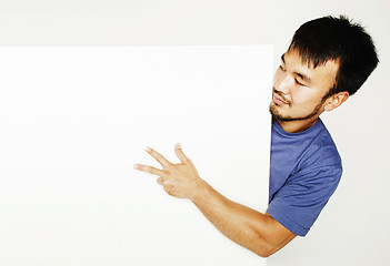 Image showing pretty cool asian man holding empty white plate smiling