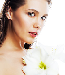 Image showing young pretty woman with  Amarilis flower close up isolated on wh