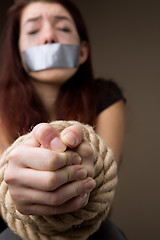 Image showing Crying girl with tied hands