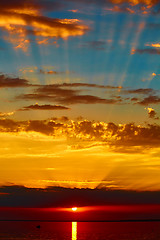 Image showing good red sunset over darken sea