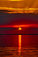 Image showing Sunrise in the sea with soft wave and cloudy