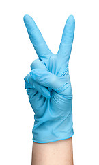 Image showing Hand in blue latex glove showing two fingers