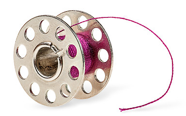 Image showing Metal spool with burgundy thread